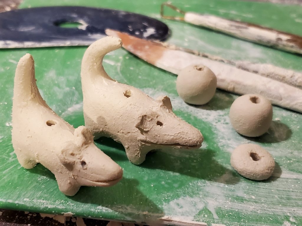 greenware porcelain clay beads shaped like opossum