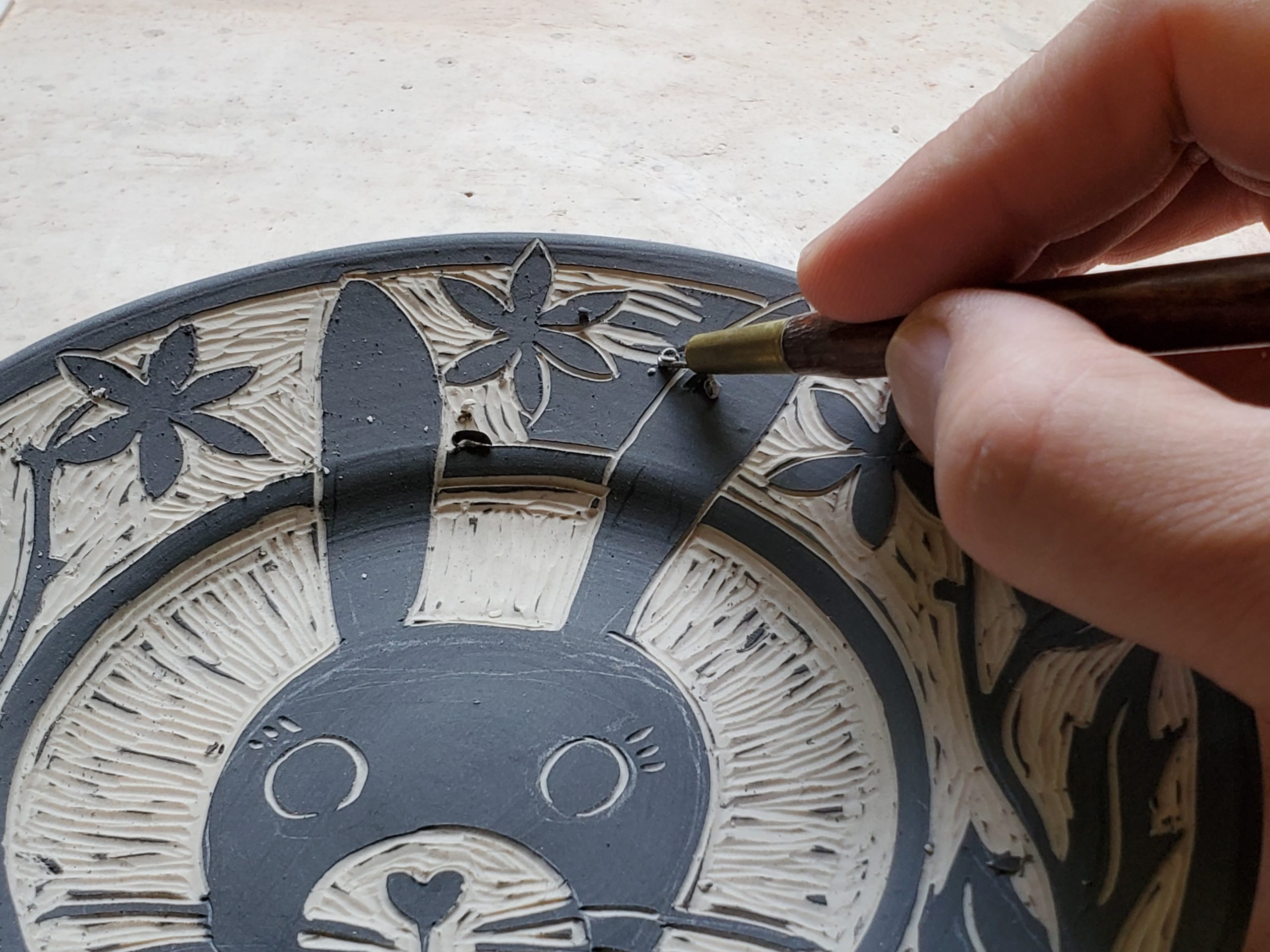 scraffito technique carving porcelain saucer