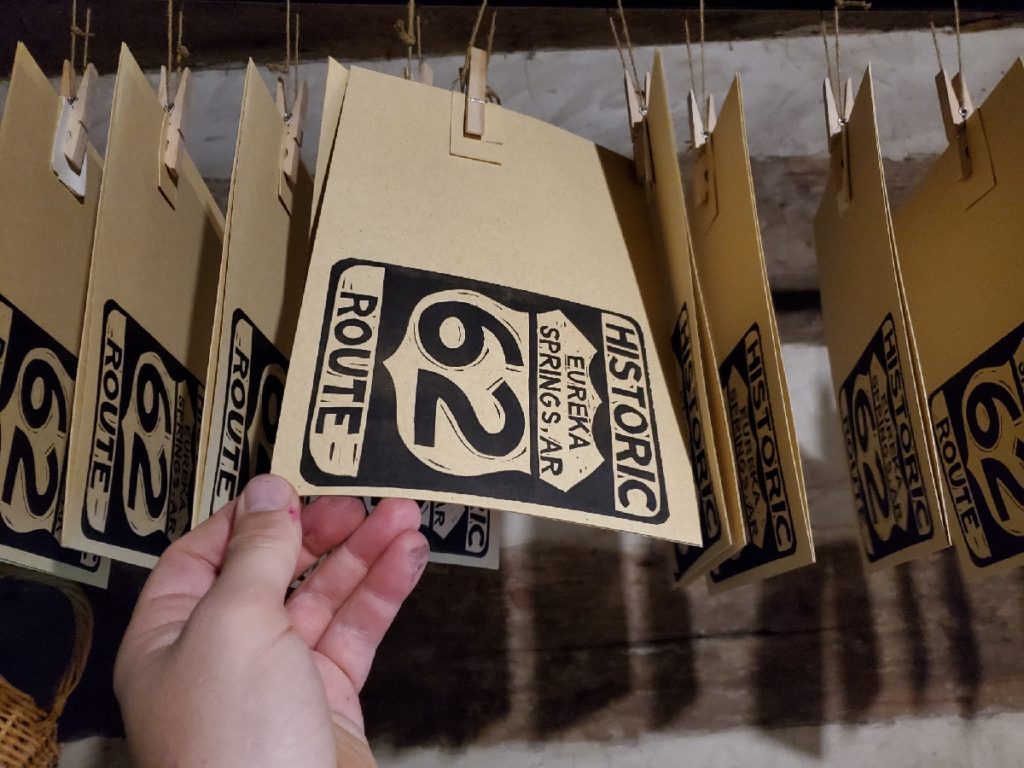 Us Route 62 linocut notecards in drying rack