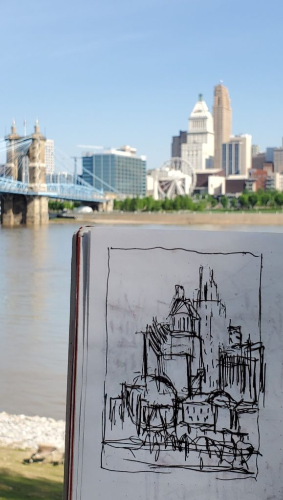 sketch of cincinnati skyline with photo of skyline in background