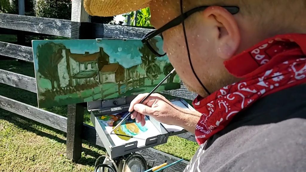 close up of artist painting stone house in May's Lick, Kentucky