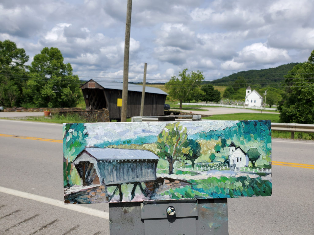 plein air oil painting of the goddard bridge with actual bridge in the background of the photo