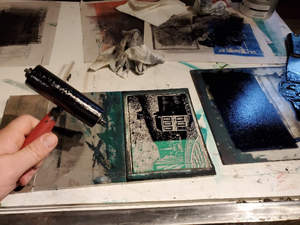 putting ink on a linoleum block print