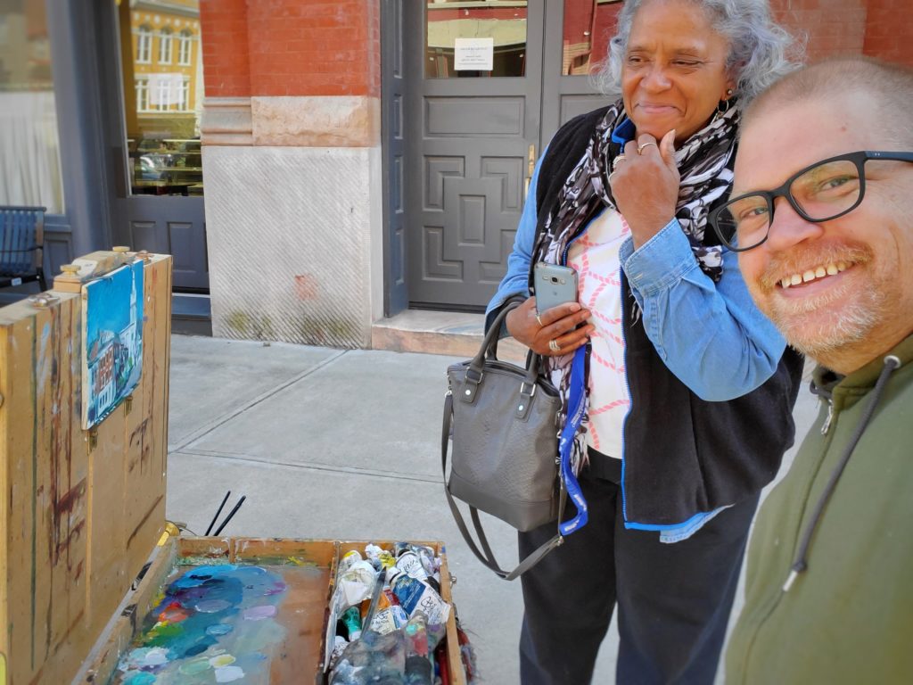 ken swinson painting with friend, brenda williams admiring the painting in maysville kentucky