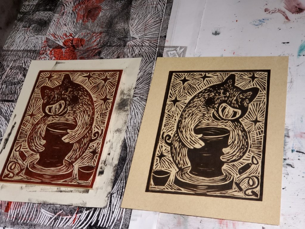 test proof of woodcut of pig making pottery