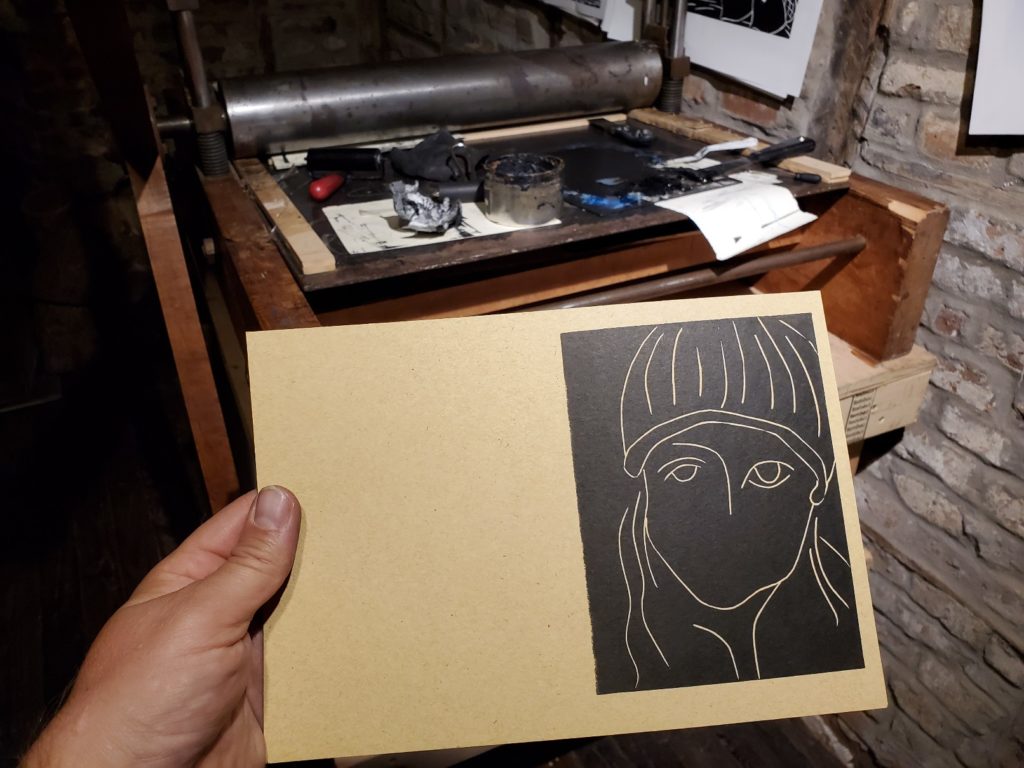 test proof of a linocut portrait of a girl with hat by artist betsy adams