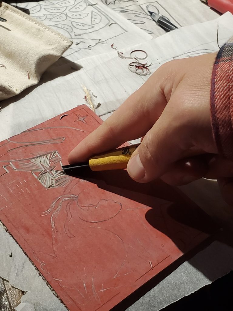 a close up of carving a linocut