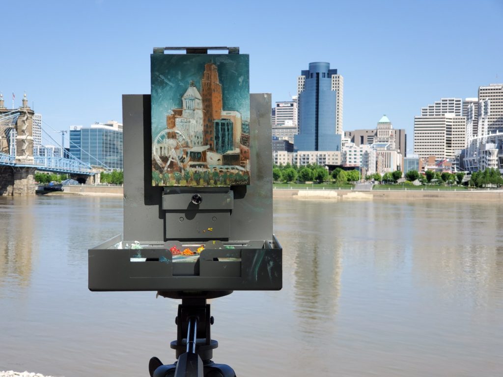 plein air painting of downtown cincinnati with skyline in the background