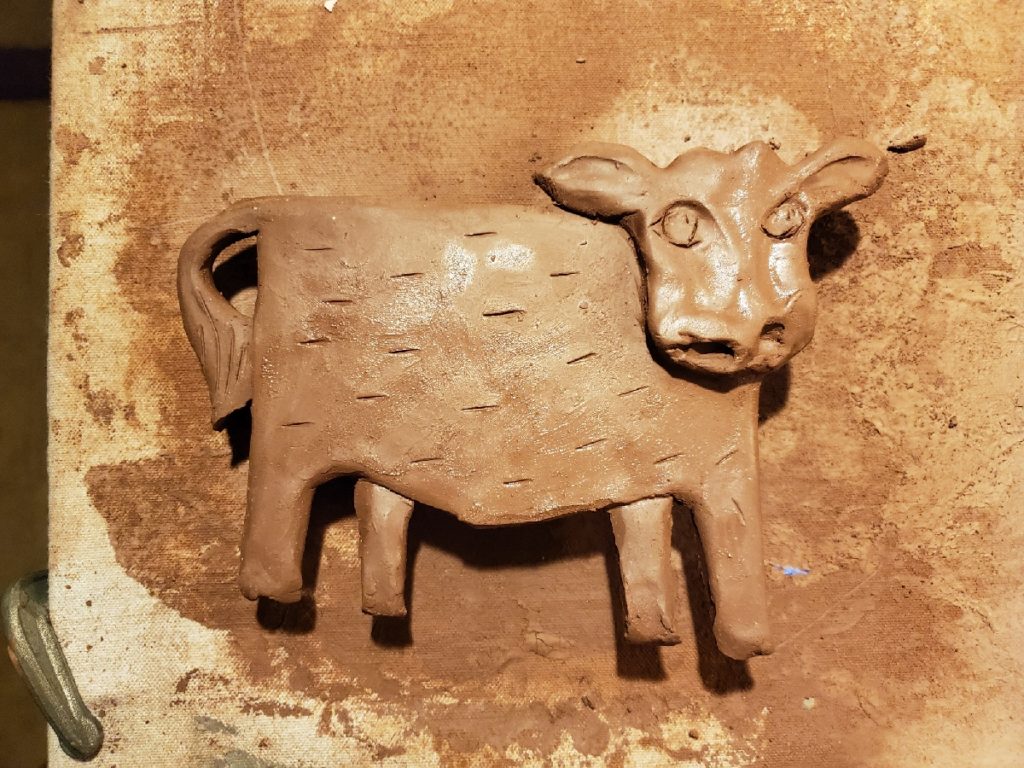 clay sculpture of a cow