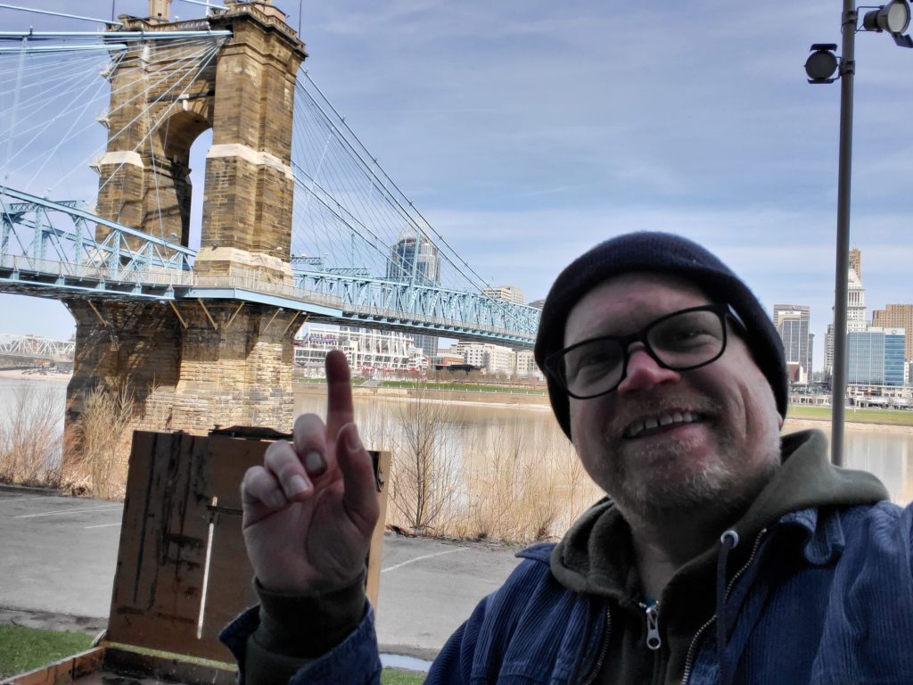 artist ken swinson at the roebling bridge in covington kentucky