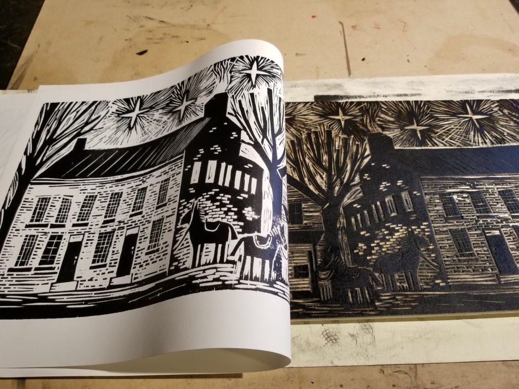 pulling a woodcut of old washington kentucky washington hall by artist ken swinson