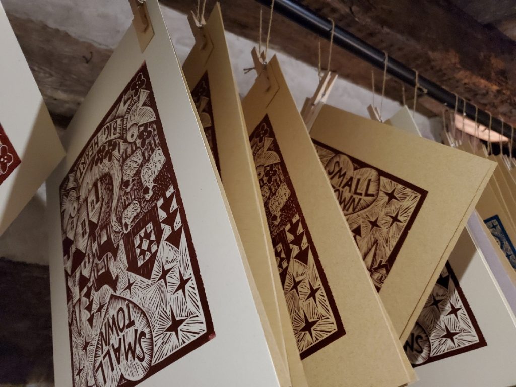 linocuts hanging in drying rack