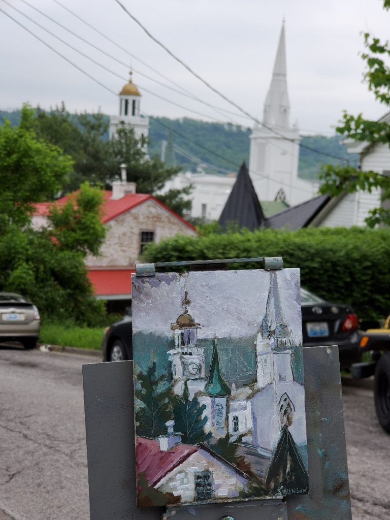 plein air painting of sutton hill in maysville kentucky with photo of church city hall and bridge in background