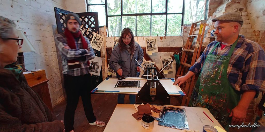 ken swinson demonstrating printmaking at the harlan hubbard studio in ft thomas kentucky