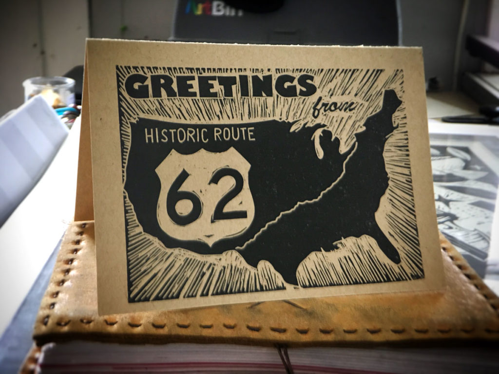 woodcut notecard with us map and 'greetings from Historic Route 62'