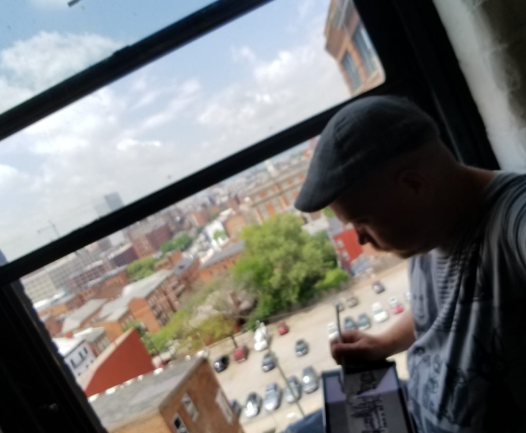 kentucky artist sketching the view of cincinnati ohio with an ipad v