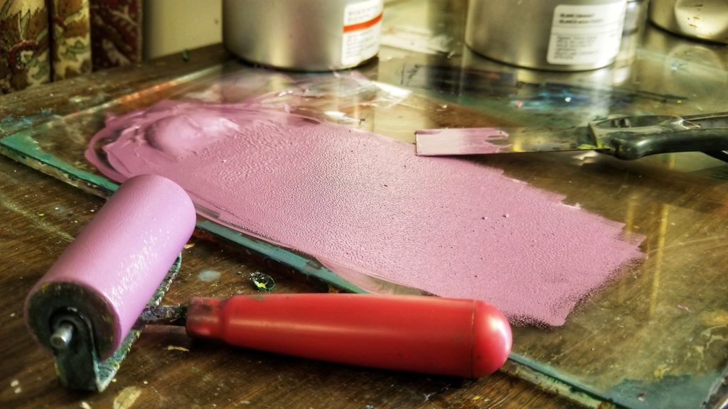 pink ink and brayer for printmaking