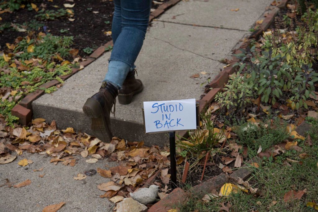 photo of person walking to studio