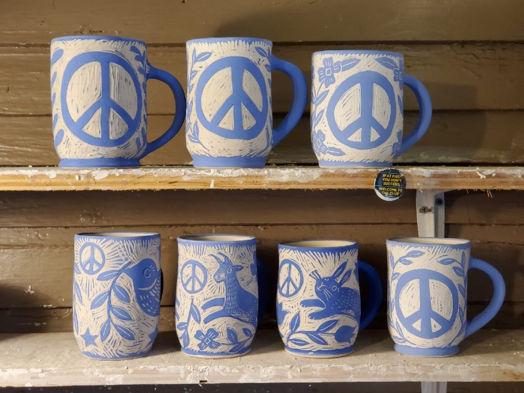 porcelain mugs - work in progress - blue with different peace symbols