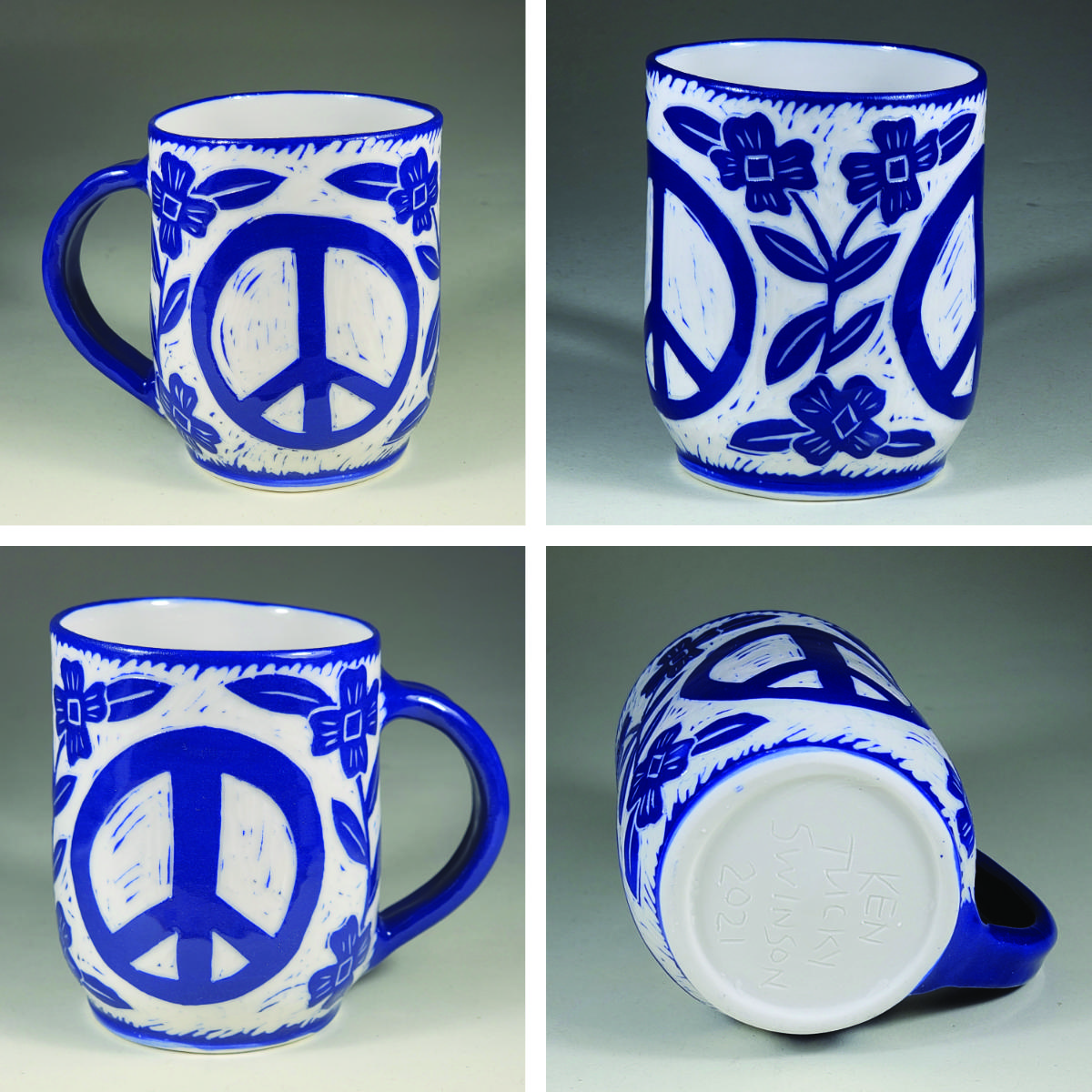 porcelain cup with blue sgraffito peace symbol and flowers