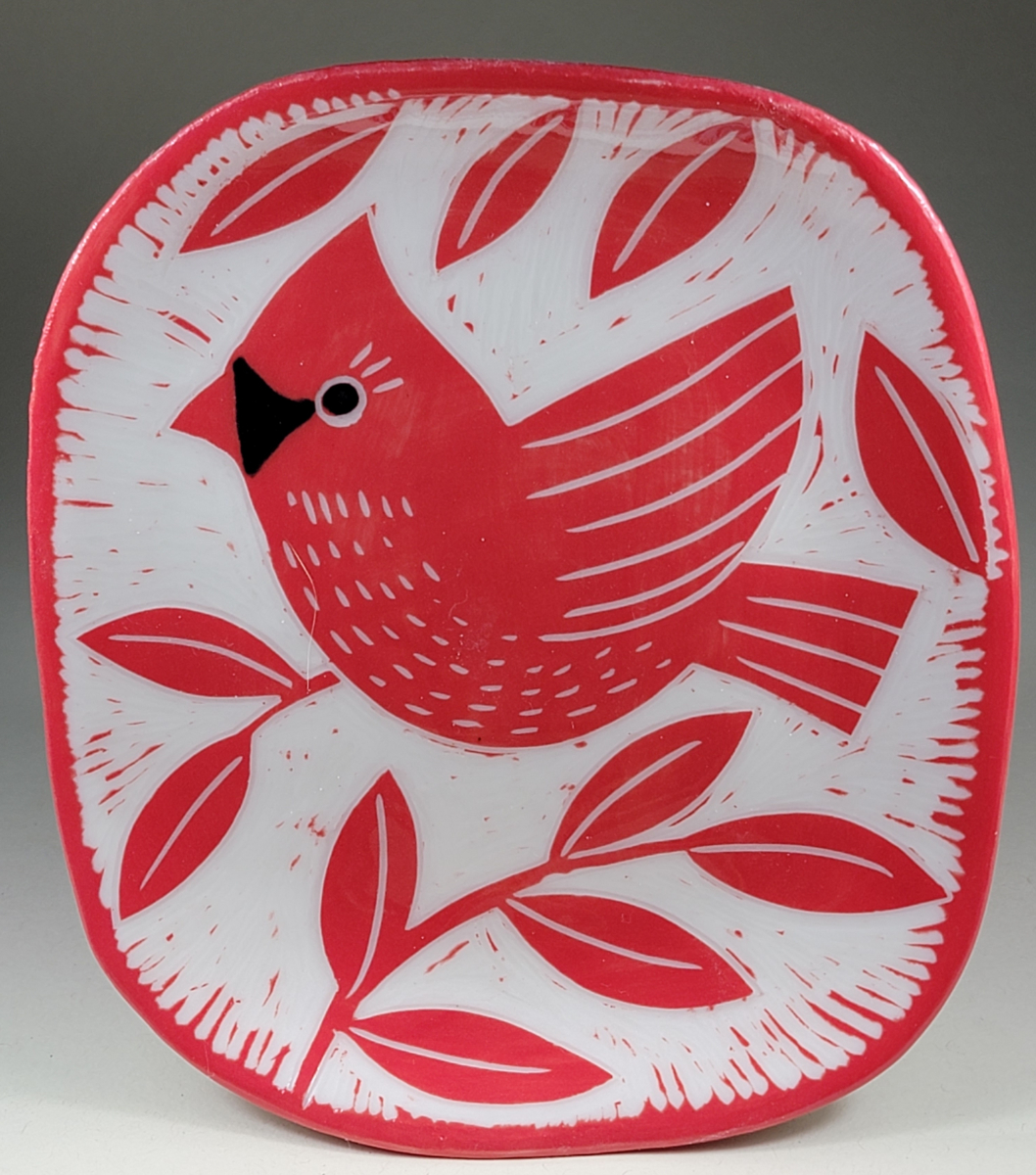 porcelain plate with red cardinal sgraffito design