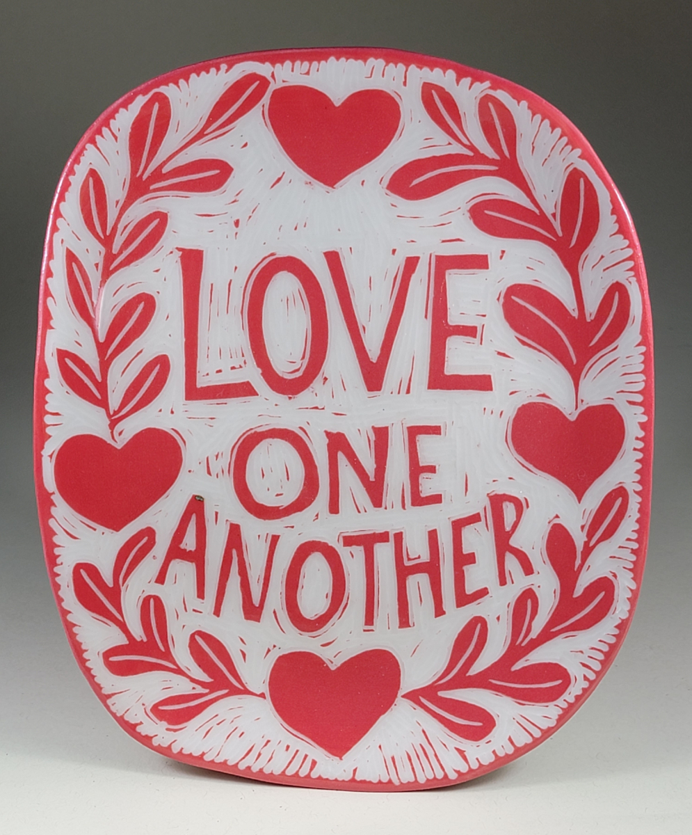 porcelain plate with love one another red sgraffito design