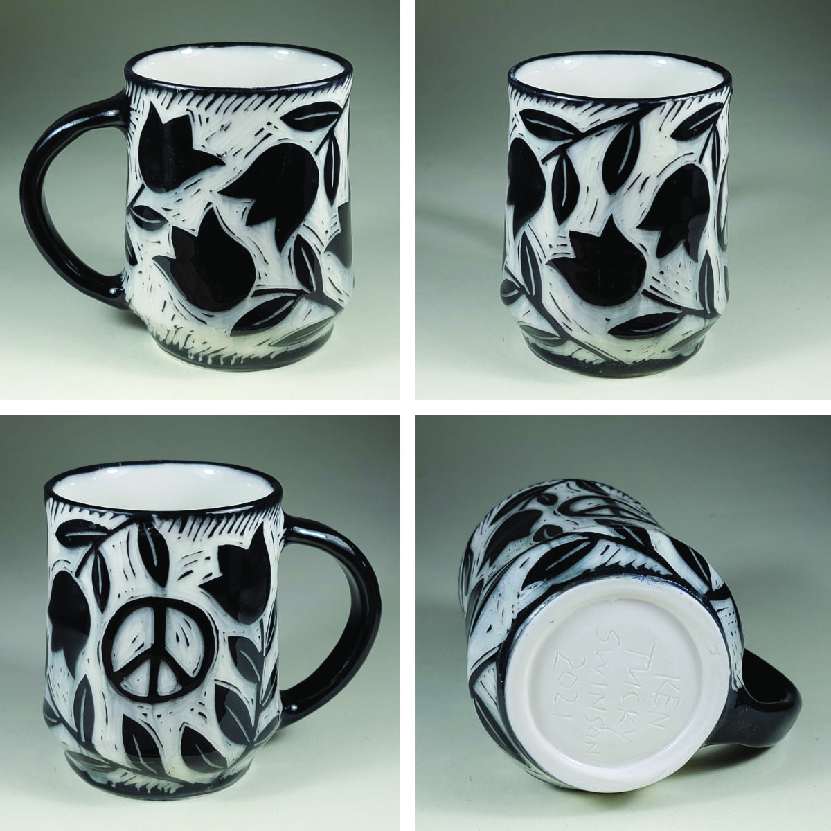 porcelain cup with tulip and peace symbol black sgraffito design