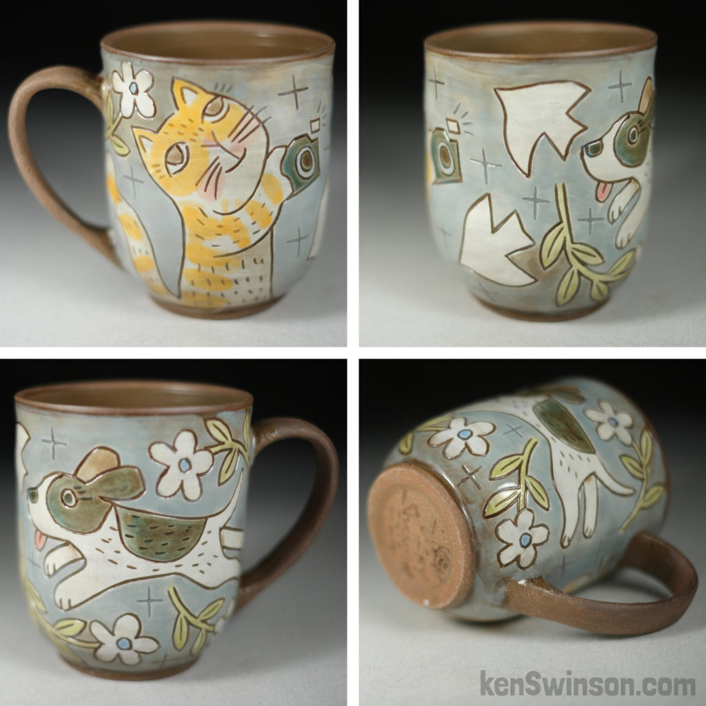 handmade stoneware cup with cat taking photo of dog surface design