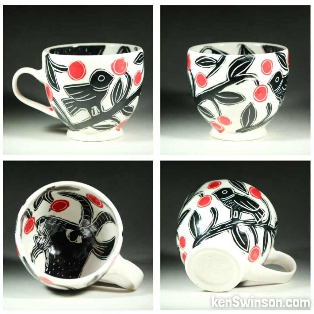 Handmade, wheel thrown porcelain cup by Kentucky artist, Ken Swinson with a birds on the exterior, a goat eating cherries on the interior