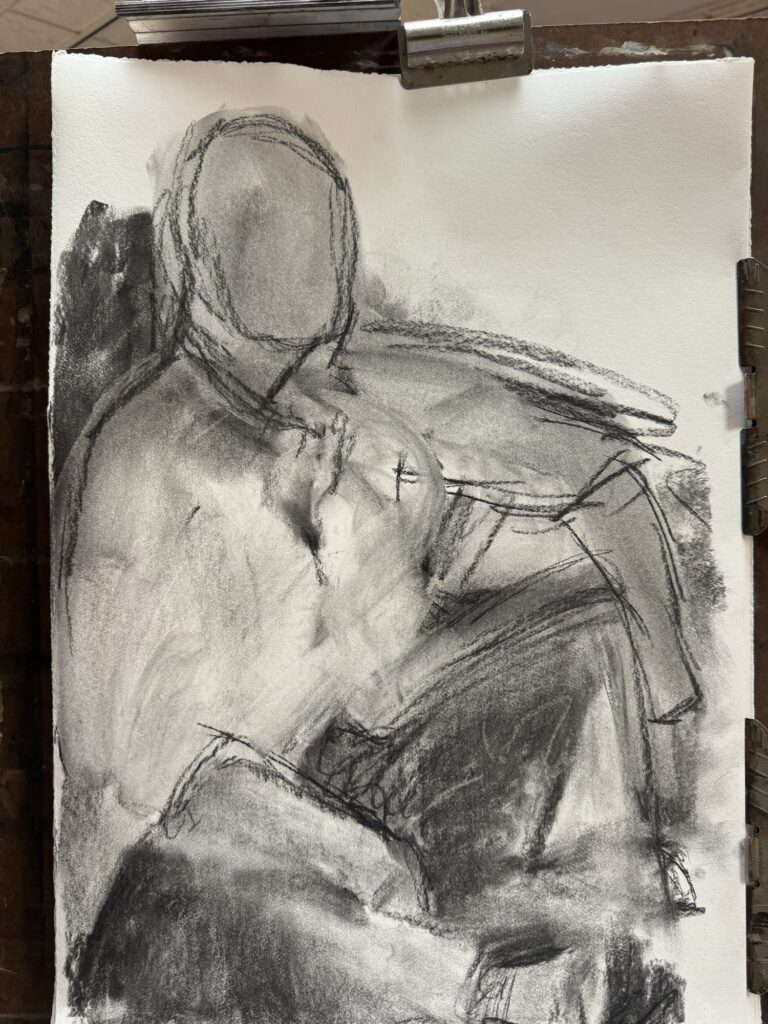 beginning of a charcoal drawing of a man