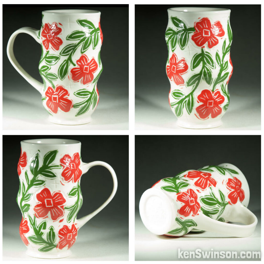 Handmade, wheel thrown porcelain cup with flower decoration