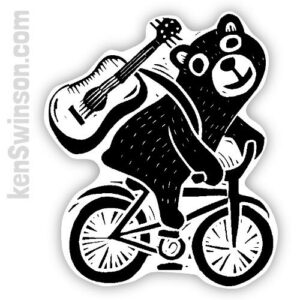 sticker by kentucky artist Ken Swinson depicting a bear on a bike with a guitar strapped to its back