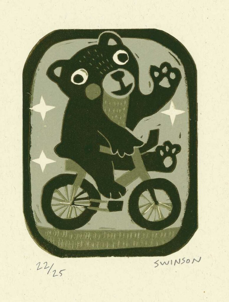 Multi colored reduction linocut of bear riding bicycle. Carved and printed by Kentucky artist Ken Swinson